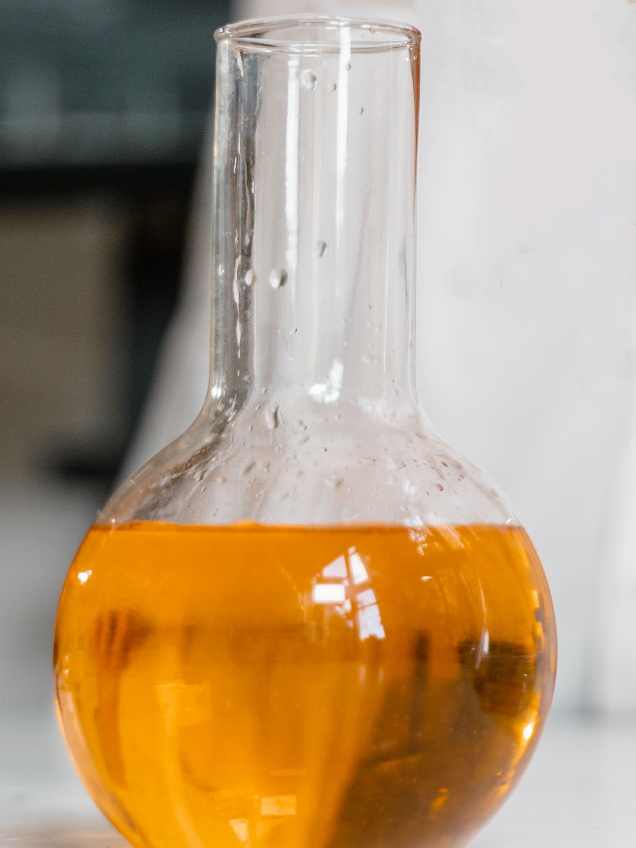 Amber viscous liquid sample, emulsifier additive for metalworking fluid